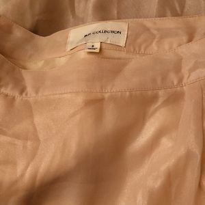 Long sheer skirt size S brand new no tag. Gold shimmer